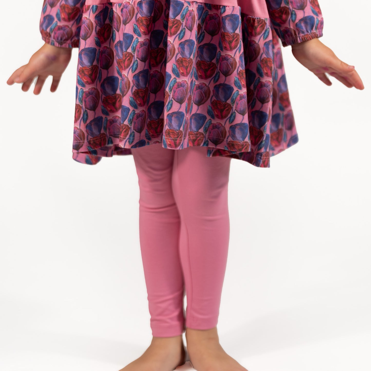Young Girl in Floral Dress With Pink Leggings