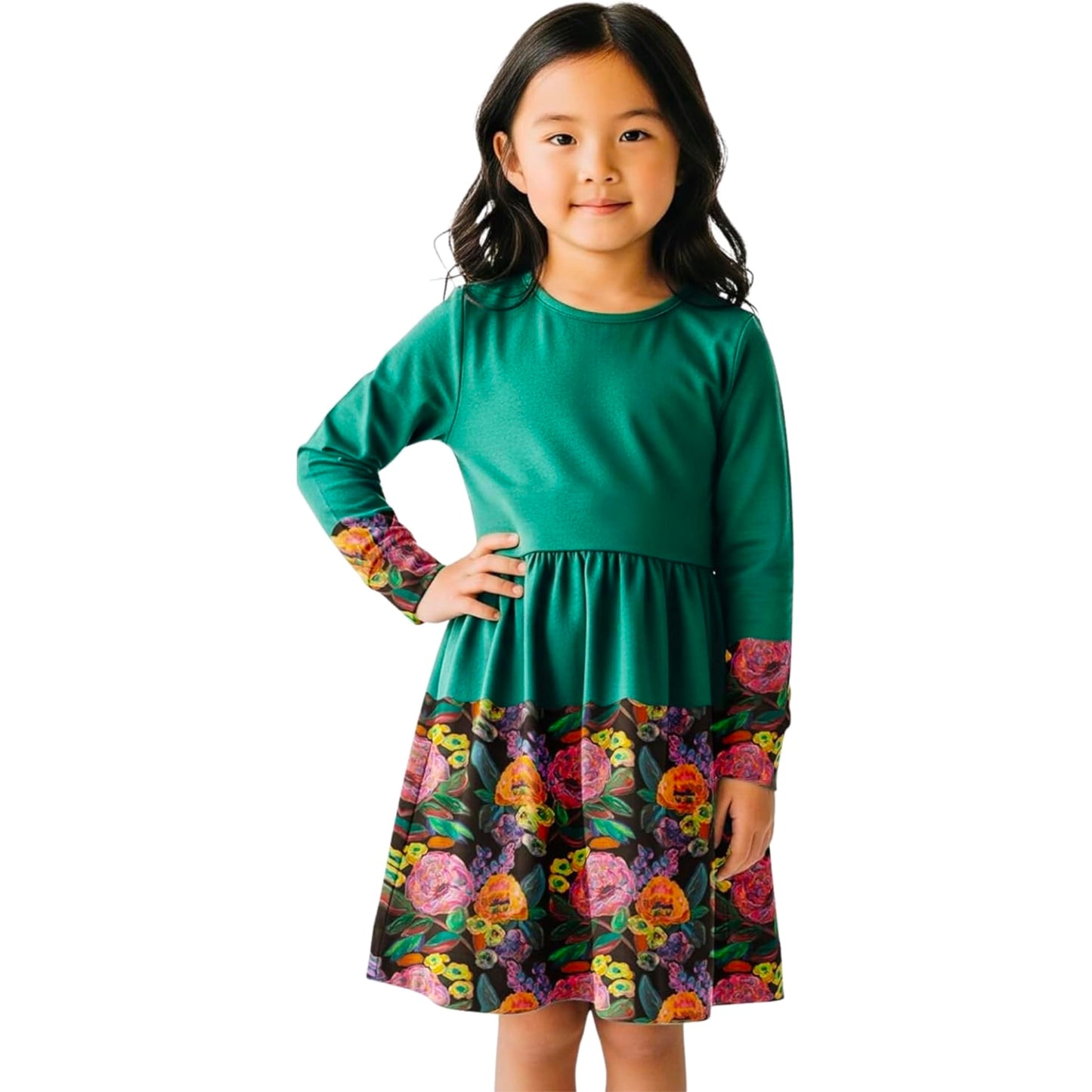 Young girl wearing a green dress with floral patterned sleeves on a white background