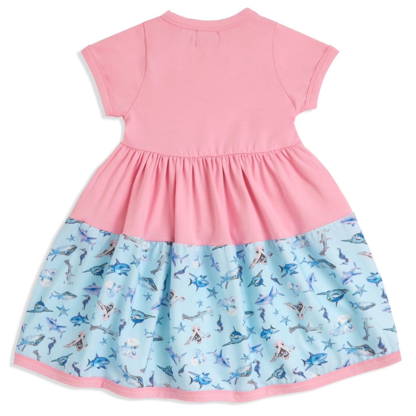 Back of pink girls twirl dress laid flat includes matching scrunchie – breathable cotton fabric and whimsical underwater pattern