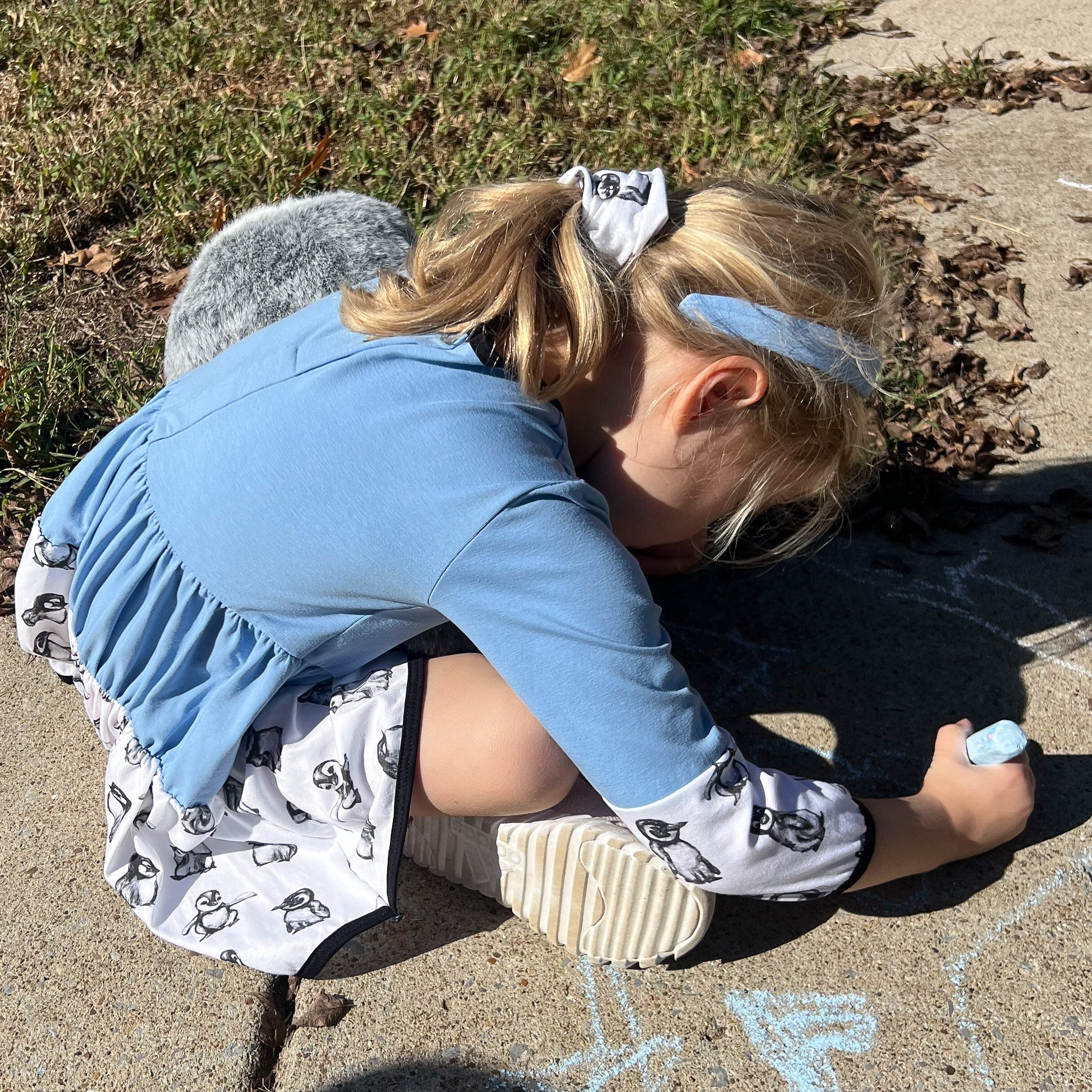 Girl in Penguin Twirl Dress